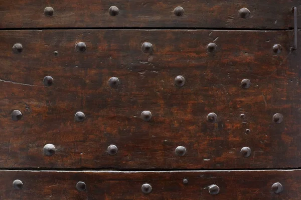 Old wooden door with nails texture background — Stock Photo, Image