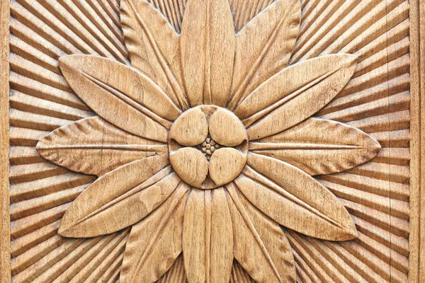 Carved flower on wooden texture background — Stock Photo, Image