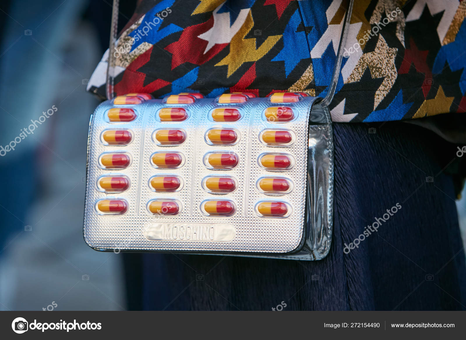 Woman with silver Moschino bag with yellow and red capsule medicines before  Max Mara fashion show, Milan Fashion Week street style on September 21,  2017 in Milan. – Stock Editorial Photo © AndreaA. #272154490