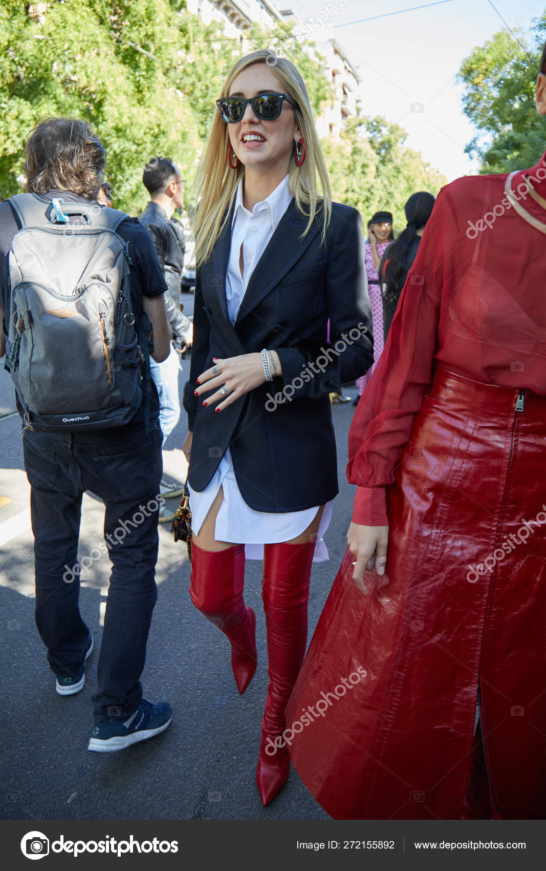 Chiara Ferragni with red leather boots, black jacket and white