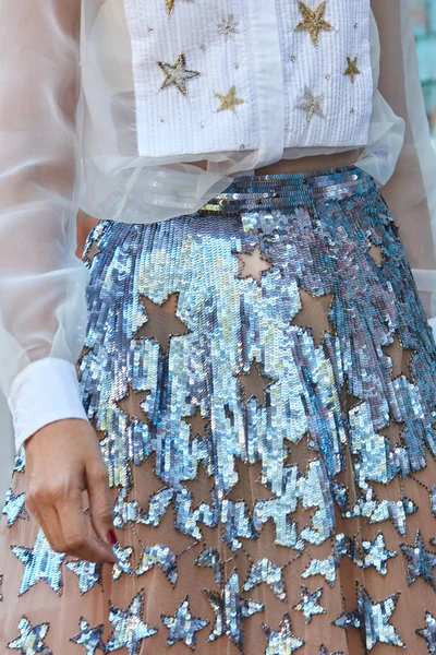 Woman with blue sequins star pattern on transparent dress before Fendi fashion show, Milan Fashion Week street style on September 21, 2017 in Milan. — Stock Photo, Image