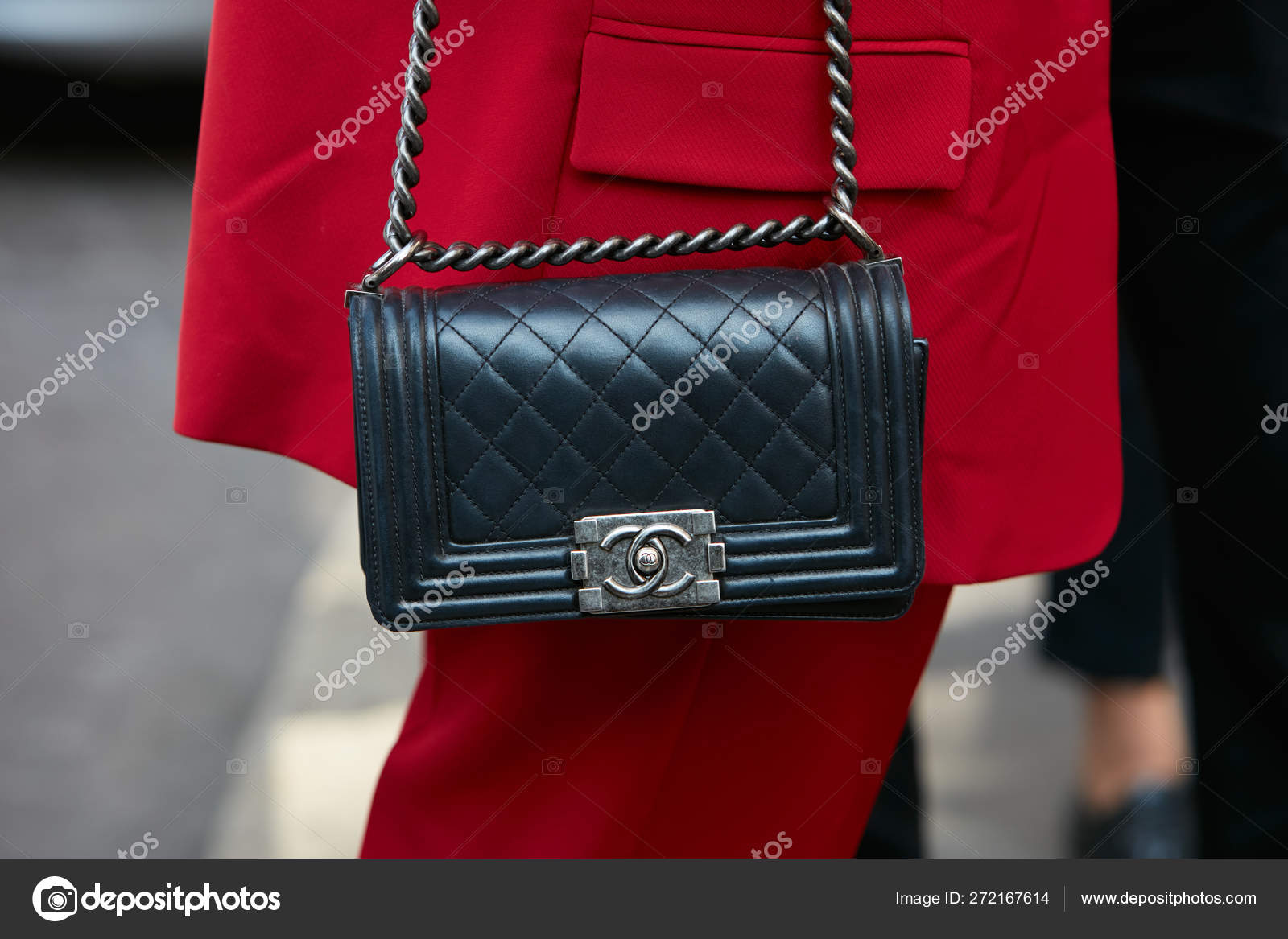 Woman with black leather Chanel bag and red suit before Antonio Marras  fashion show, Milan Fashion Week street style on September 23, 2017 in Milan.  – Stock Editorial Photo © AndreaA. #272167614