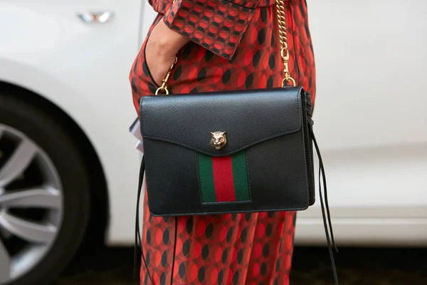 Woman with Louis Vuitton bag and Chanel scarf before Fendi fashion show,  Milan Fashion Week street style – Stock Editorial Photo © AndreaA.  #326233302