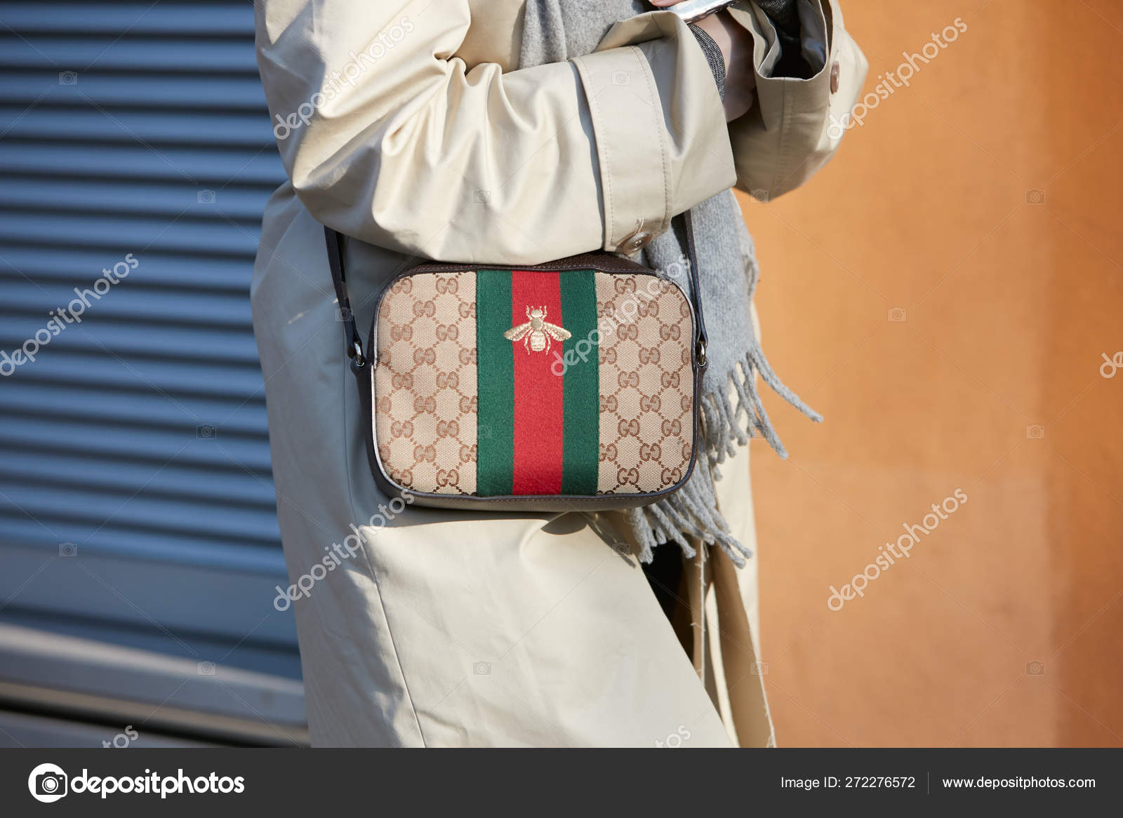MILAN - JANUARY 13: Woman with Gucci bag with bee and green and