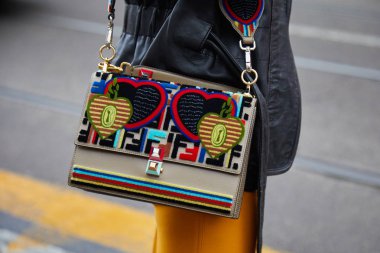 MILAN - FEBRUARY 22: Woman with Fendi bag with velvet hearts dec