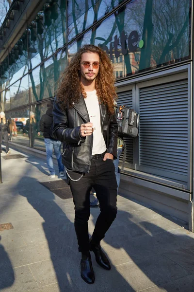 stock image MILAN - JANUARY 13: Man with black leather jacket and long hair 
