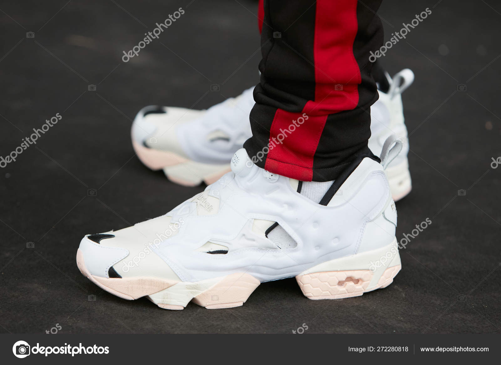 gøre ondt Skoleuddannelse Vær forsigtig Man with white Reebok Insta pump shoes and black trousers with red stripe  at Pal Zileri before fashion show, Milan Fashion Week street style on  January 15, 2018 in Milan. – Stock