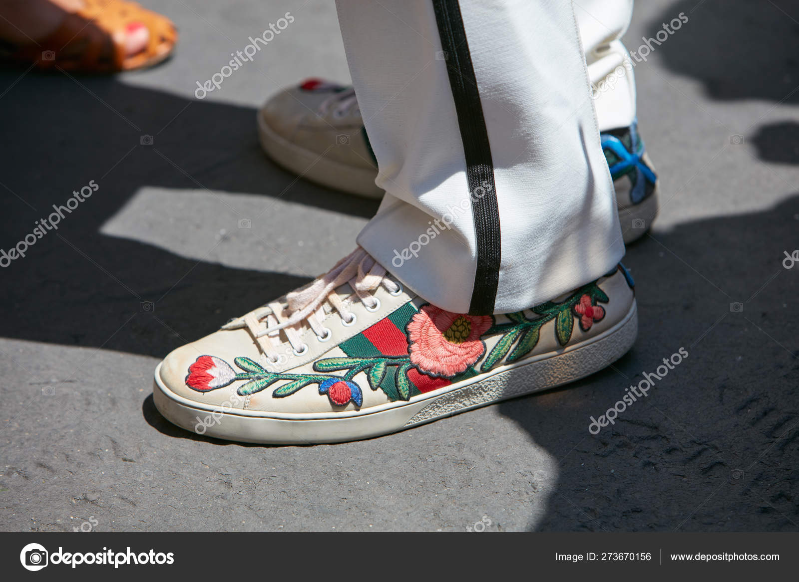 Man with Gucci Sneakers with Floral Decoration before Salvatore