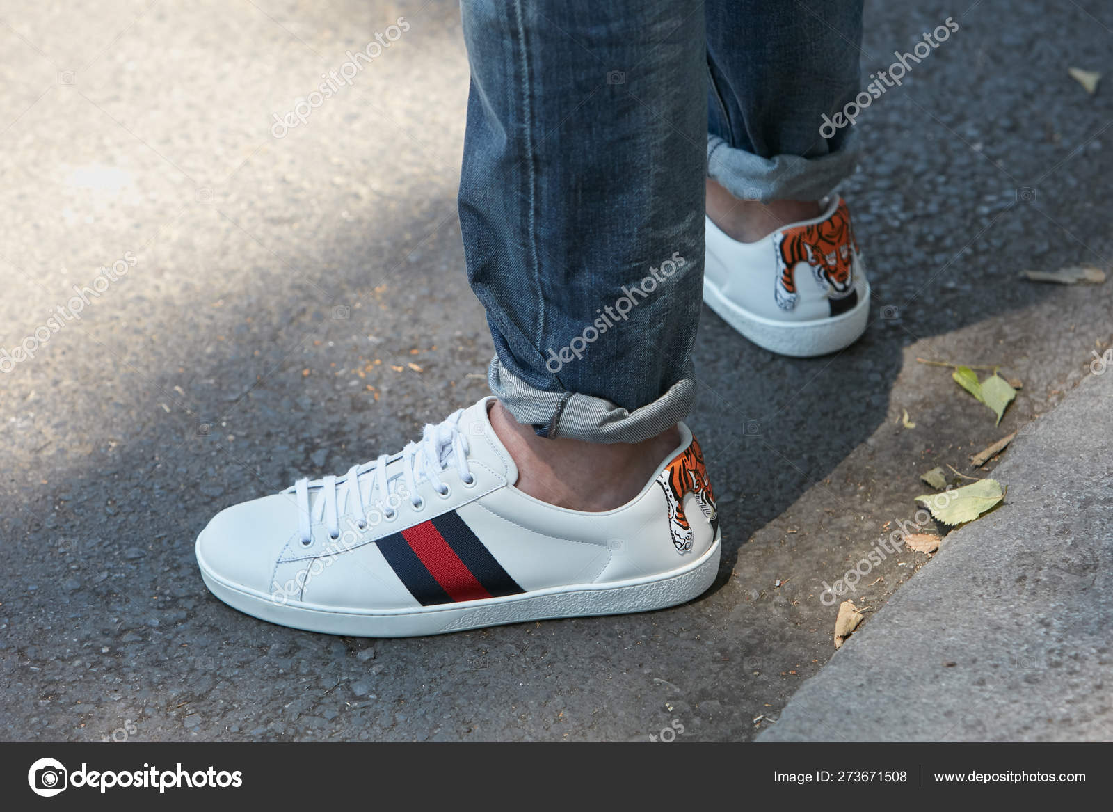 Man with white leather Gucci sneakers 