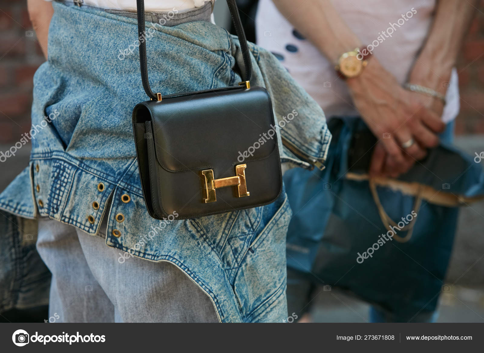 Woman with Black Leather Yves Saint Laurent Bag before Fendi