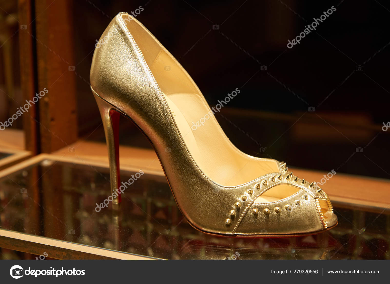 Christian Louboutin high heel golden shoes with studs in fashion ...