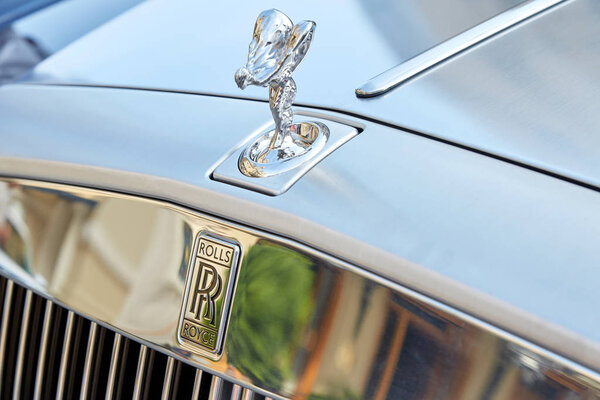 Rolls Royce gray luxury car statue and logo in a summer day in Monte Carlo, Monaco.