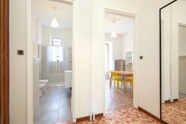 Apartment entrance in renovated interior with bathroom and kitchen — Stock Photo, Image