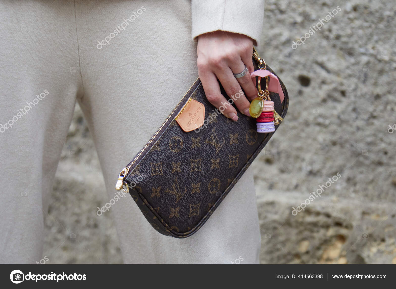 Woman with white Louis Vuitton bag with colorful logos on September 21,  2018 in Milan, Italy Stock Photo
