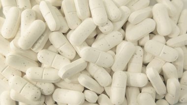 Kollajen yığını yakın çekim arka plan, içinde yardım veya deri, kemik ve ligament sağlıklı bakımı için temel alınarak kapsül tüketimi güzellik için bir alternatif protein tedavi takviyeleri