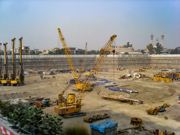 Cranes and drilling rig machines on the construction site