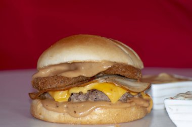 Chicken cheese burger on red background 