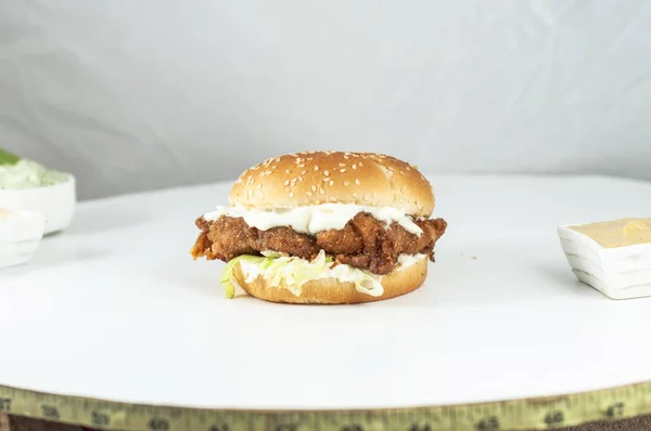 Burger and sauces with white background