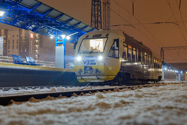 Kyiv, Ukraine - December 14, 2018: The rail bus PESA 620M travel from Kyiv to Boryspil airport. At the Kiev Passenger Station on the platform at night.