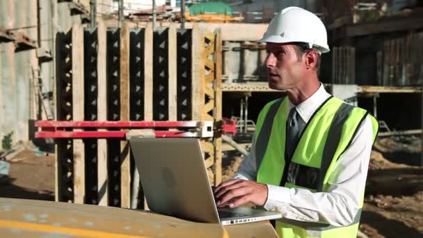 Mature Man Using Laptop Construction Site — Stock Video