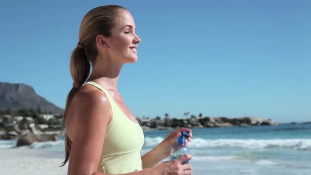 Young Woman Drinking Water Beach — Stock Video