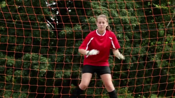 Girl Goalkeeper Being Hit Ball — Stock Video