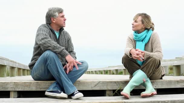 Couple Talking Coastal Walkway Holding Hands — Stock Video