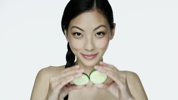 Young Woman Holding Cucumber Slices Eyes — Stock Video