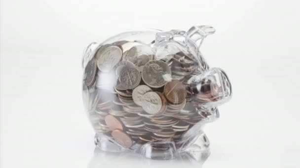 Transparent Piggy Bank Full Coins White Background — Stock Video