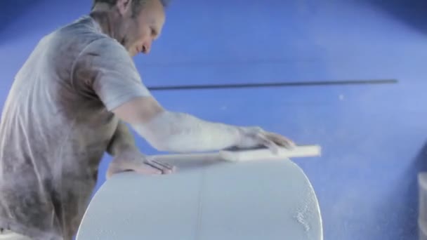 Mature Man Sanding New Surfboard — Stock Video