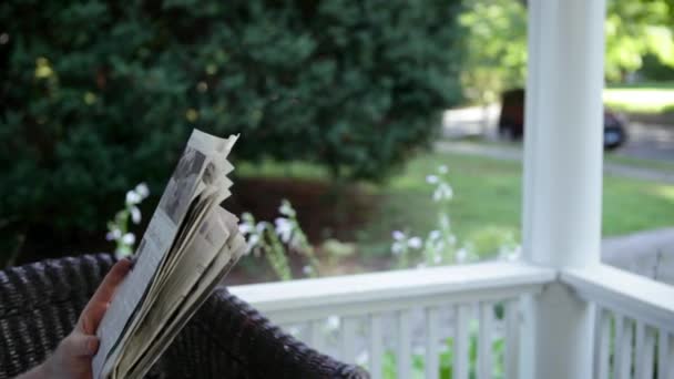 Senior Man Reading Newspaper Drinking Lemonade — Stock Video