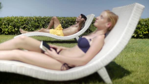 Young Couple Lying Sun Loungers — Stock Video
