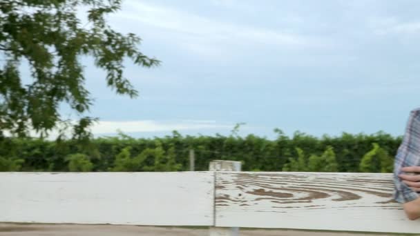 Cheerful Woman Leaning Fence Ranch — Stock Video