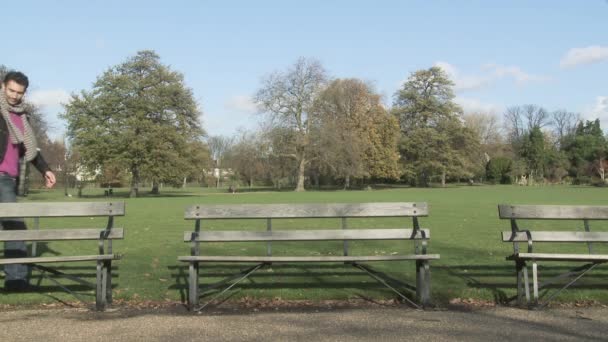 Couple Holding Hands Woman Walking Benches — Stock Video