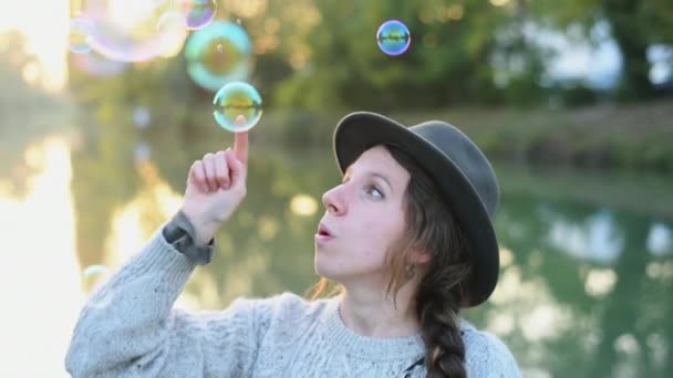 Woman Catching Soap Suds Outdoors — Stock Video