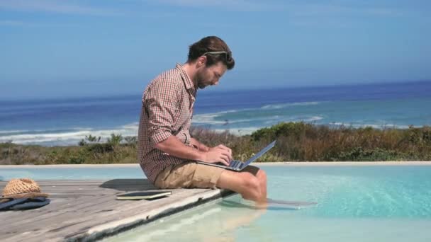 Man Using Laptop Pool Sea — Stock Video