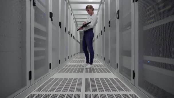 Young Woman Using Laptop Server Room — Stock Video