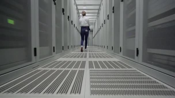 Young Woman Using Laptop Server Room — Stock Video