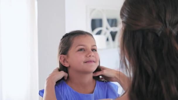 Shoulder View Mother Adjusting Daughter Hair — Stock Video