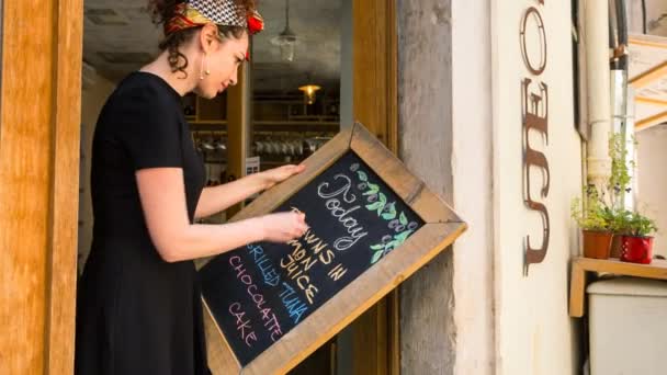 Woman Writing Menu Blackboard — Stock Video