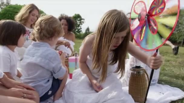 Girl Playing Pinwheel Picnic Dinton Wiltshire United Kingdom — Stock Video