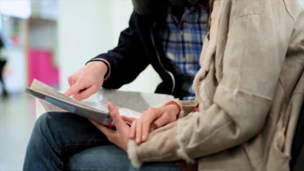 Young Couple Examining Map Airport — ストック動画