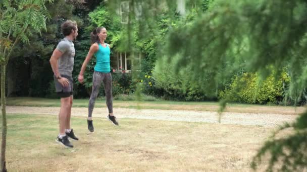 Man Woman Doing Jump Squats Garden — Stock Video