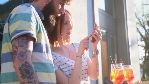 Couple Using Smartphone Sidewalk Cafe — Stock Video