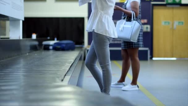 Women Picking Wheeled Luggage Baggage Claim Airport — 비디오
