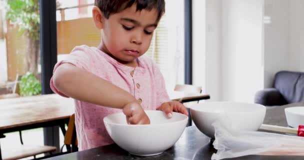 Boy Licking Cream Bowl — Stock Video