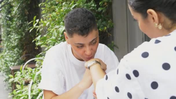 Lesbian Couple Holding Hands Talking Sidewalk Cafe — Stock Video