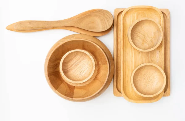 Dřevěná pultík, miska a lžíce nádobí izolované na bílém pozadí — Stock fotografie