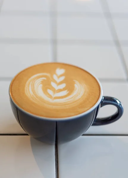 Latte art coffee cup on white table — Stock Photo, Image