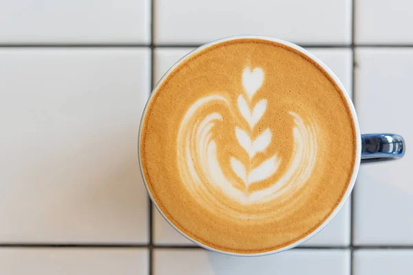 Latte art coffee cup on white table,top view — Stock Photo, Image